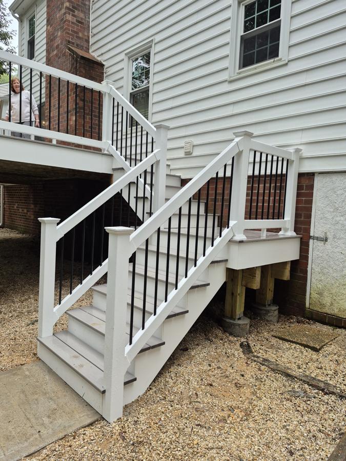 Composite stairs with white PVC railing