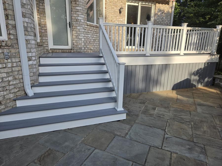 Composite steps with white railing and skirting