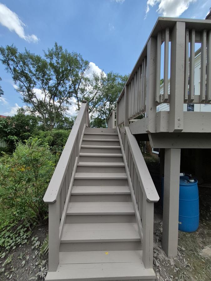 Painted stairs up to an elevated deck