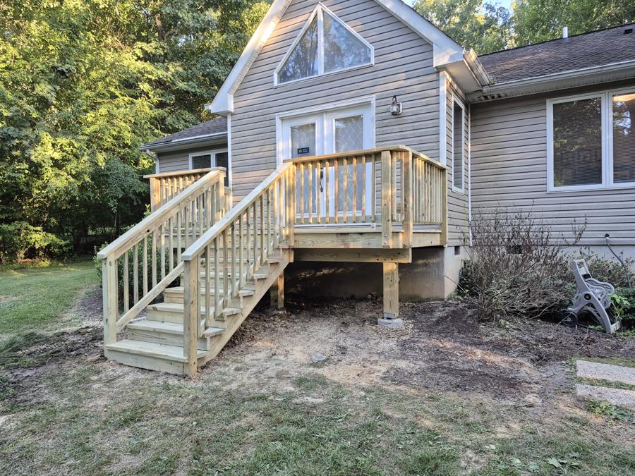 Pressure-treated landing and stairs at a back door