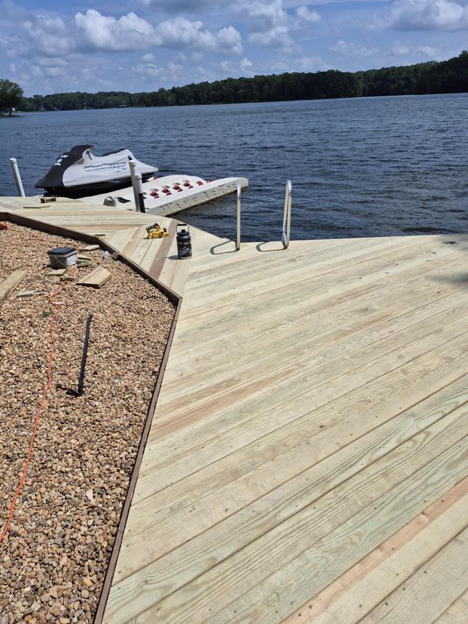 Waterfront deck and boardwalk with swim ladder on Lake Anna