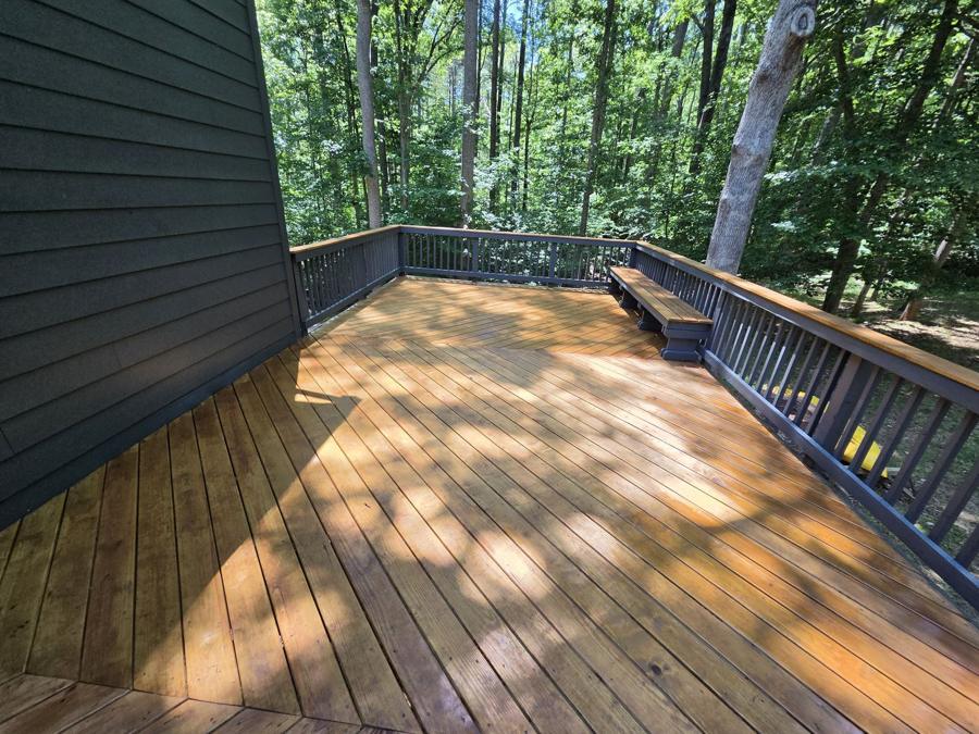Restored and stained wood deck in the woods