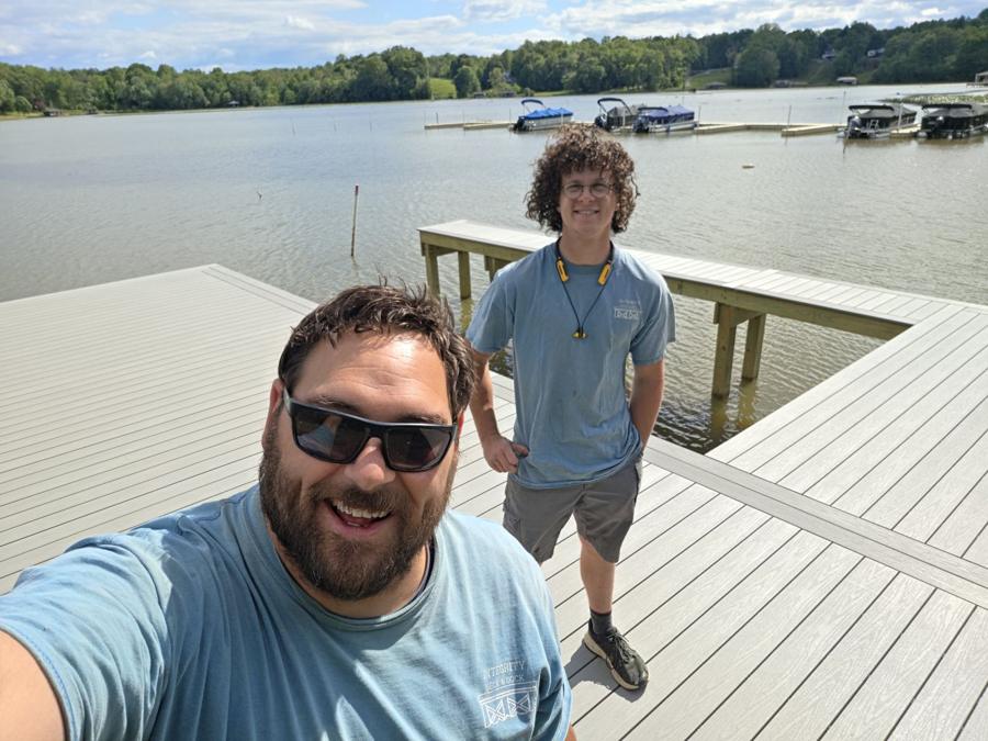 Owner Daniel Robertson and crew on a finished dock